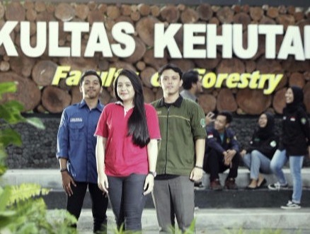 Young Indonesian conservationists stand in front of the forest faculty of Gadjah Mada University